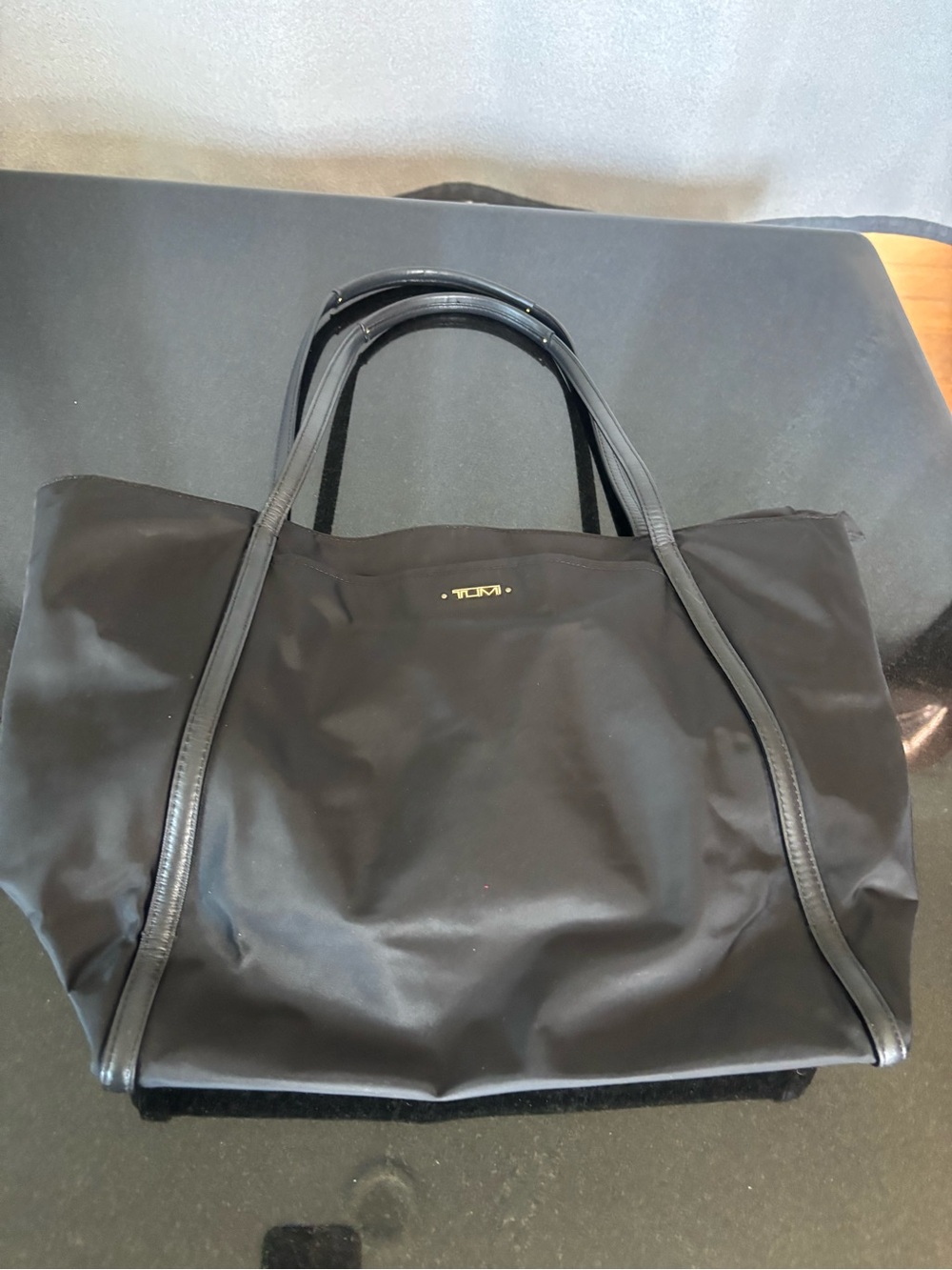 TUMI Voyageur Black Travel Tote Bag with multiple compartments & Luggage Slot
